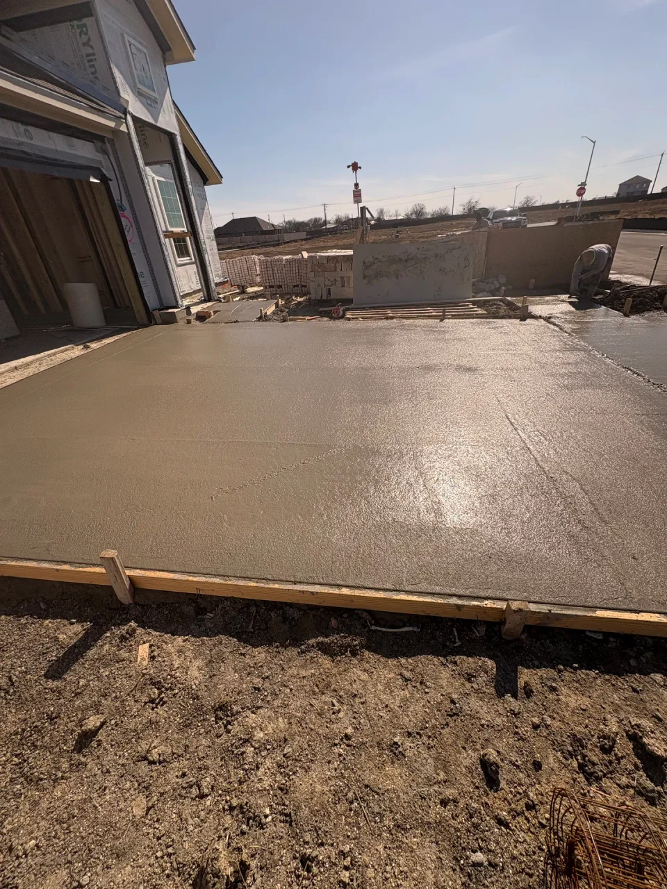 Side view of the newly poured Creedmoor driveway