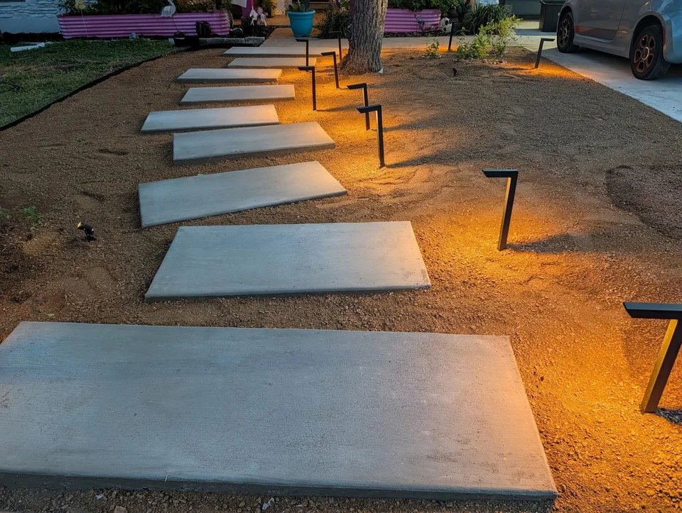 Floating steps set in crushed granite with black path lights