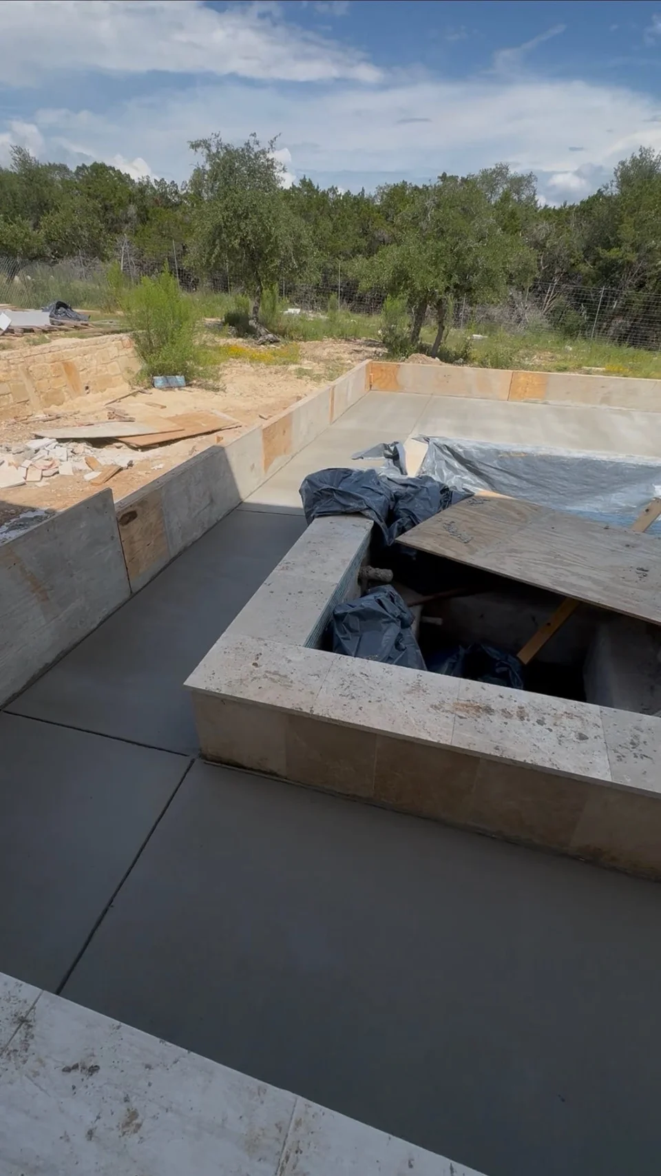 Poolside concrete patio with integrated stairs