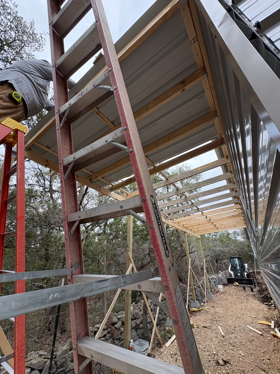 Near-complete side porch under-storage enclosure with finished access and clean lines